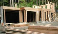 Walls of the main floor take shape above the basement
